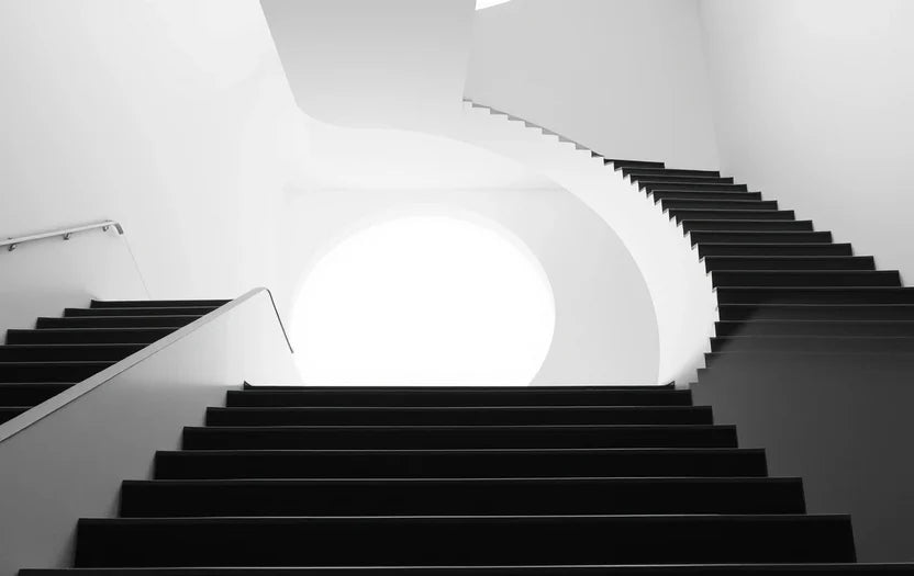 Curved staircase tunnel with arches