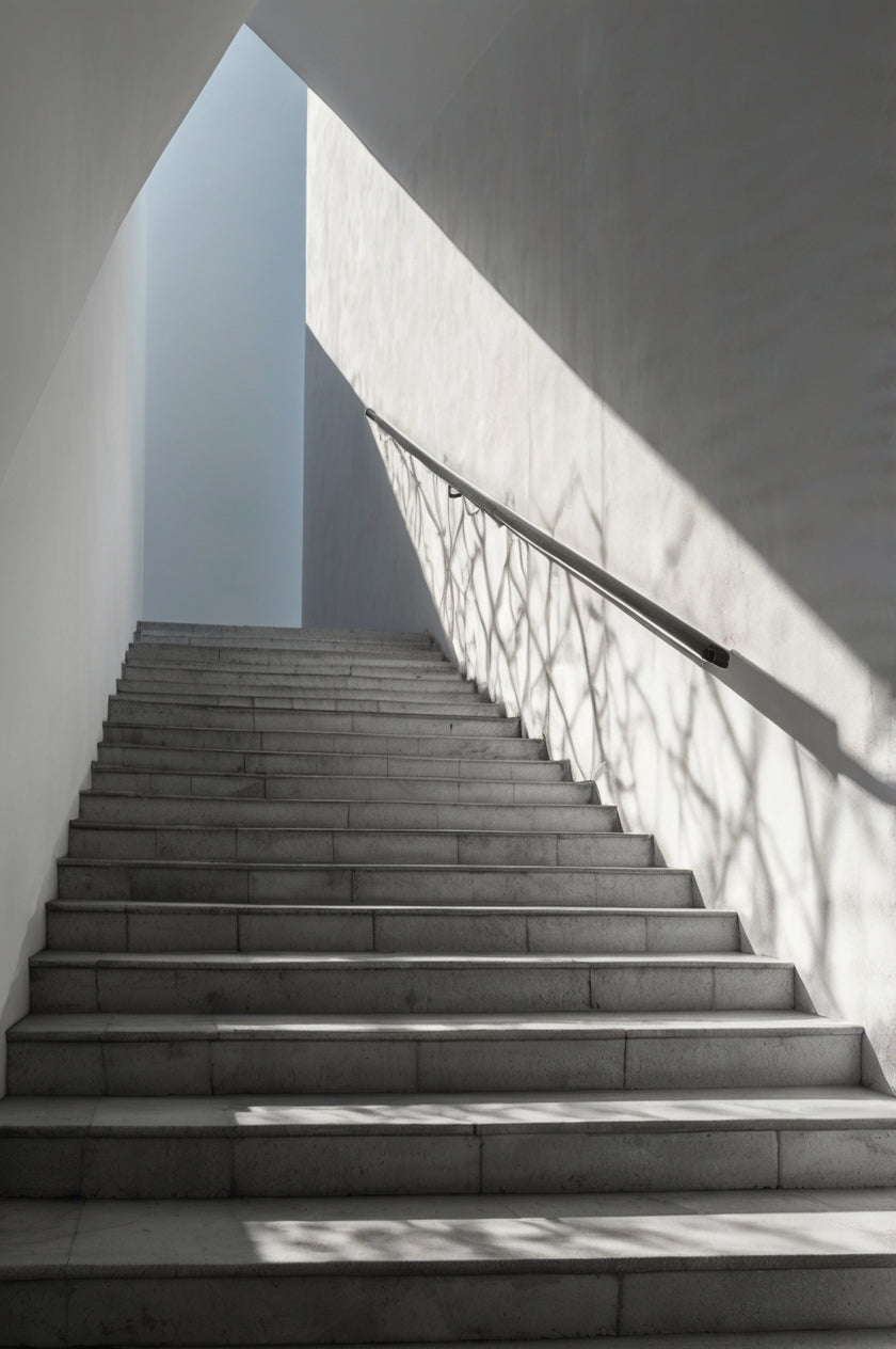 Minimalist concrete stairs with dramatic sunlight and shadows