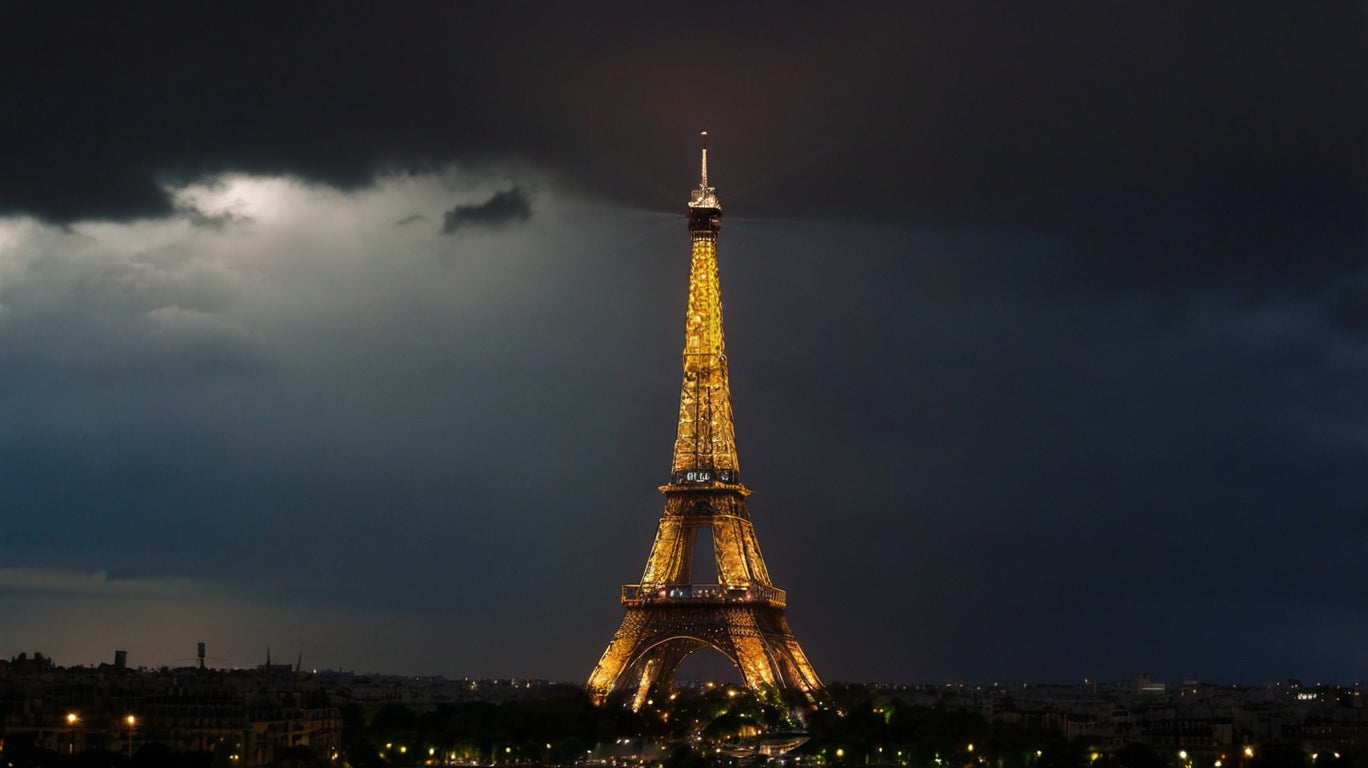 Eiffel Tower at night with stormy clouds