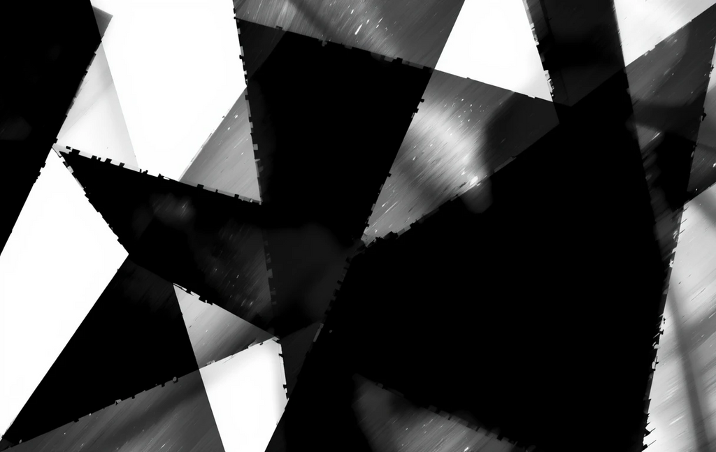 The jagged, overlapping triangular shards with dramatic reflections