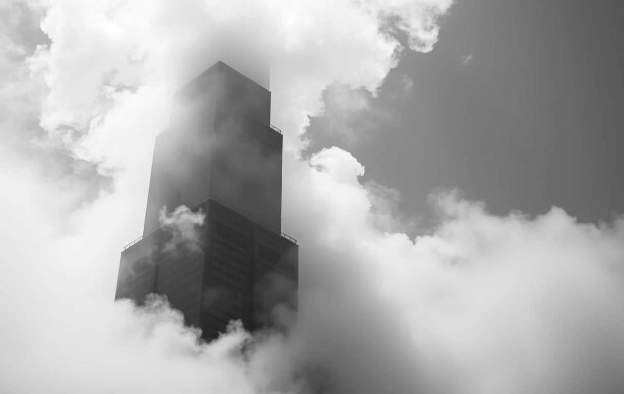 Tower emerging from clouds